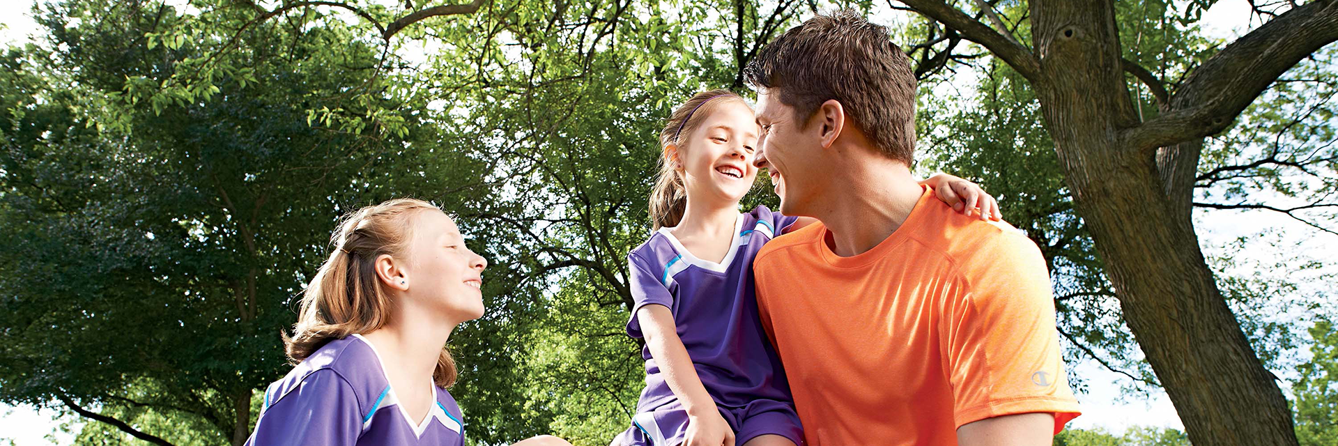 Family playing soccer