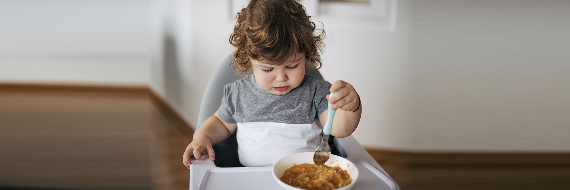 Baby playing with food