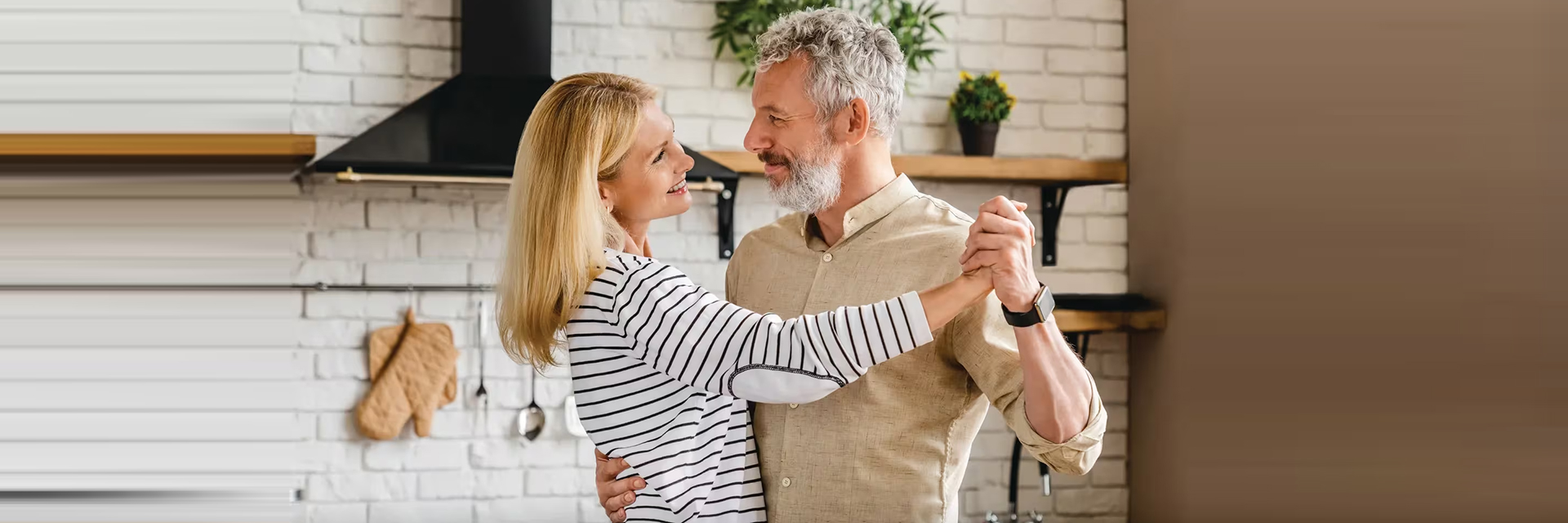 Couple dancing in kitchen