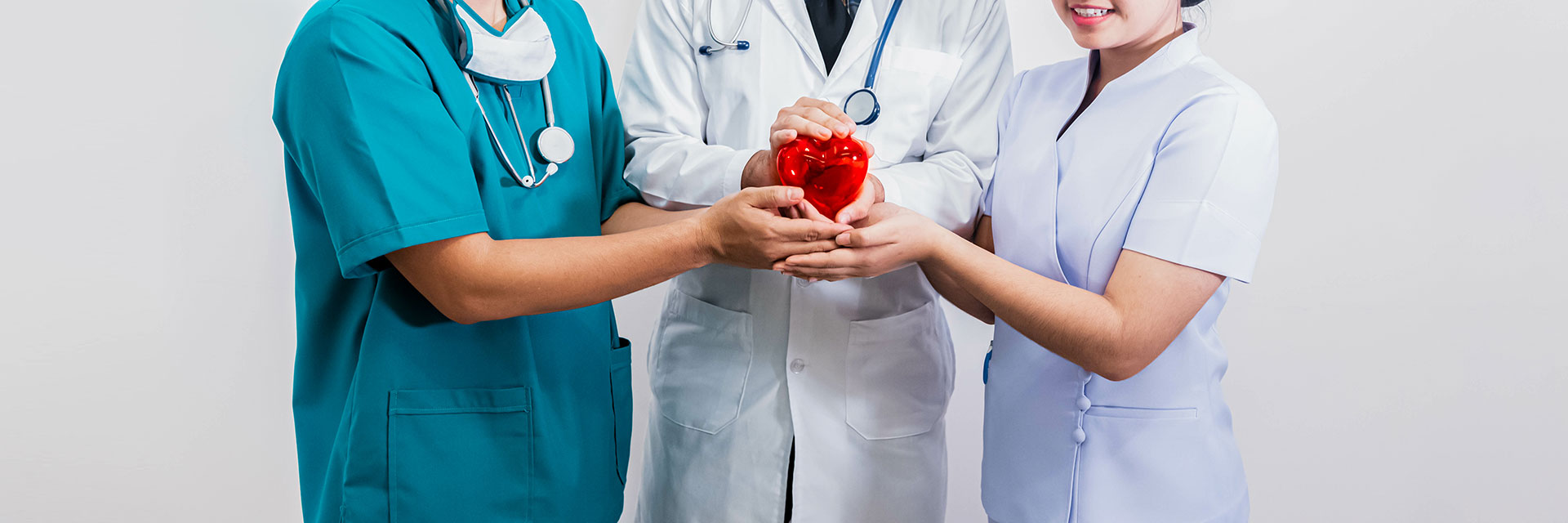 Providers holding heart