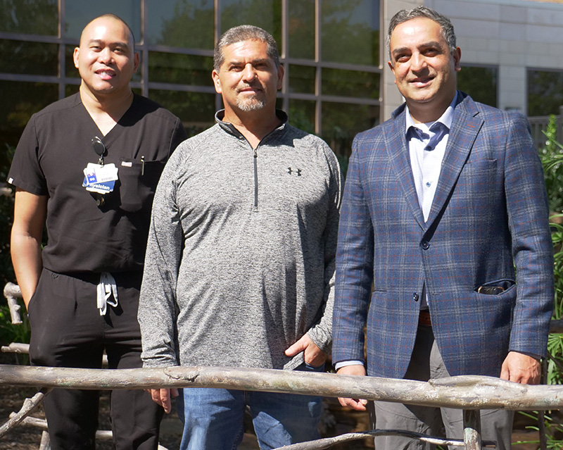 Carlos Romero with doctors