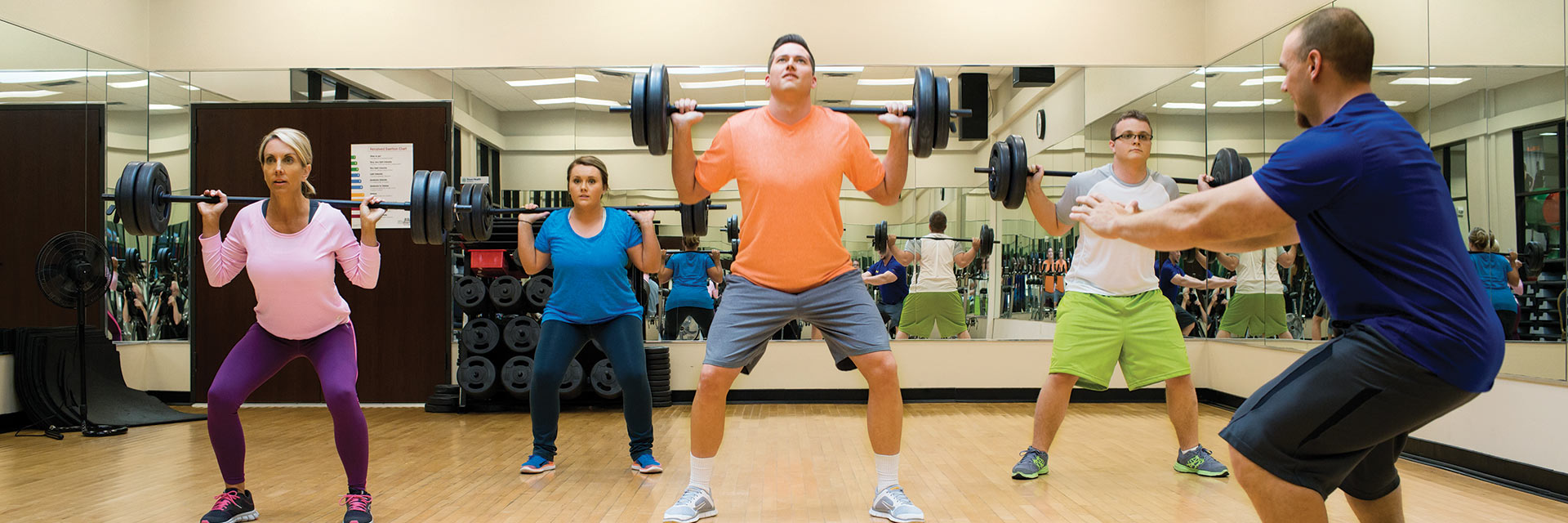 Group working out with trainer